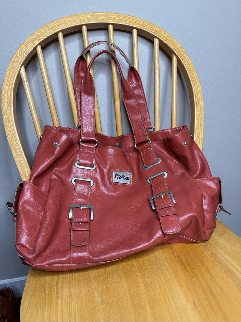 Kenneth Cole Reaction brick red shoulder tote with buckle straps